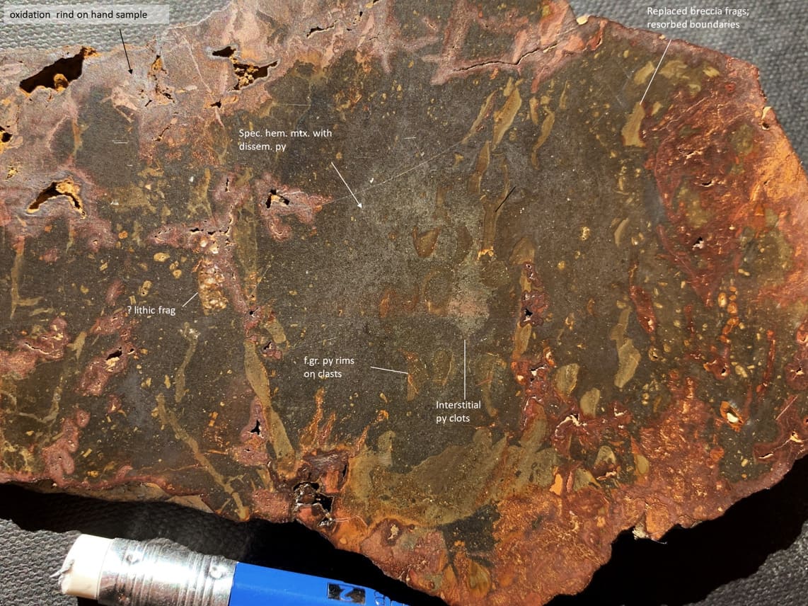 River cobbles of hematite-silica cemented hydrothermal breccia, with sulfide; VR prospecting, Mattagami River, northern Ontario