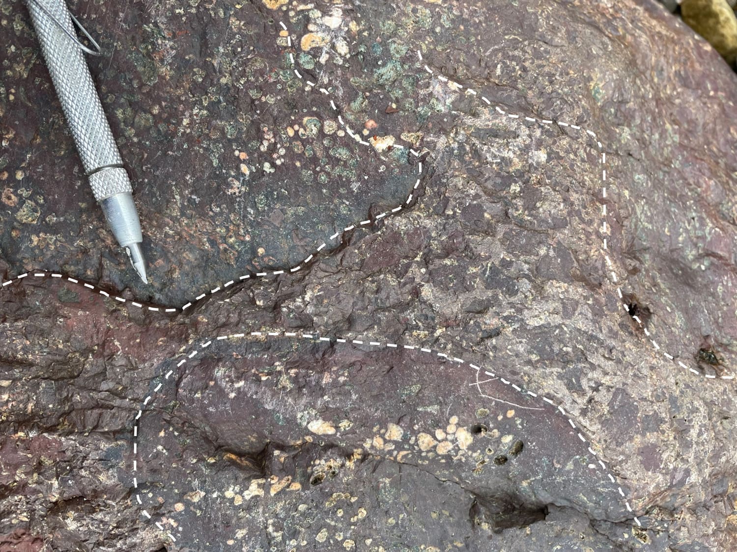 River cobbles of hematite-silica cemented hydrothermal breccia, with sulfide; VR prospecting, Mattagami River, northern Ontario